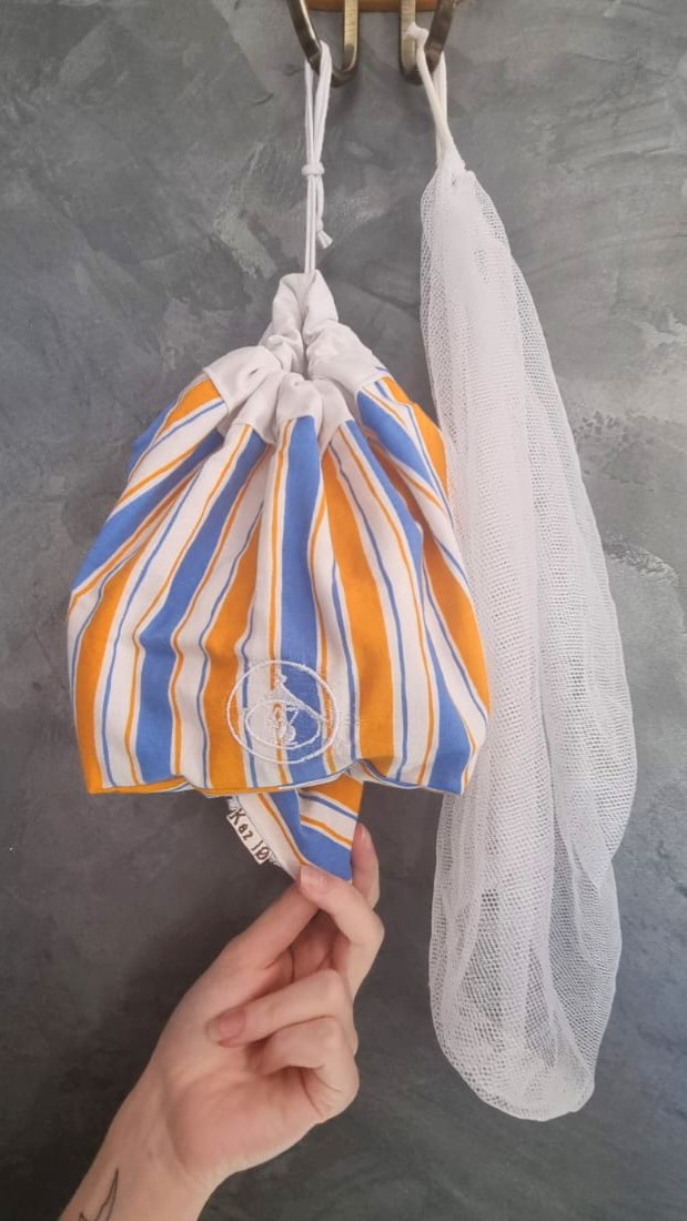 Distributeur rayures oranges et bleues